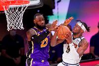 Denver Nuggets' Jerami Grant (9) drives against Los Angeles Lakers' LeBron James (23) during the second half of an NBA conference final playoff basketball game Saturday, Sept. 26, 2020, in Lake Buena Vista, Fla. (AP Photo/Mark J. Terrill)