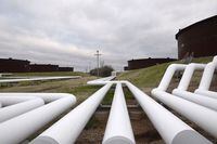 FILE PHOTO: Pipelines run to Enbridge Inc.'s crude oil storage tanks at their tank farm in Cushing, Oklahoma, March 24, 2016.