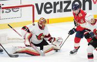 Oct 29, 2022; Sunrise, Florida, USA; Ottawa Senators goaltender Anton Forsberg (31) makes a save as Florida Panthers center Anton Lundell (15) follows on the play in the first period at FLA Live Arena. Mandatory Credit: Jim Rassol-USA TODAY Sports