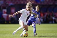 Canada defender Shelina Zadorsky ( 4) controls the ball in front of Japan midfielder Yui Hasegawa (14) during the first half in a SheBelieves Cup soccer match Wednesday, Feb. 22, 2023, in Frisco, Texas. (AP Photo/LM Otero)