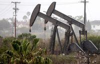 LOS ANGELES, CALIFORNIA - MARCH 28: An oil pumpjack (R) operates as another (C) stands idle on March 28, 2022 in Los Angeles, California. U.S. oil prices fell 7 percent to $105.96 per barrel while Brent crude lost 6.8 percent over demand concerns as China begins to implement a mass COVID-19 lockdown in Shanghai. (Photo by Mario Tama/Getty Images)