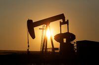 FILE PHOTO: An oil pump jack pumps oil in a field near Calgary, Alberta, July 21, 2014. REUTERS/Todd Korol/File Photo