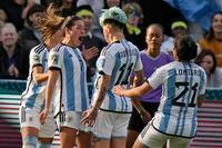 Argentina's Romina Nunez, second from left, celebrates scoring their second goal of the game during the Women's World Cup Group G soccer match between Argentina and South Africa in Dunedin, New Zealand, Friday, July 28, 2023. (AP Photo/Alessandra Tarantino)