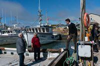Prime Minister Justin Trudeau discusses the night of Fionas passage with local fishermen at Pointe-Basse wharf in Havre-aux-Maisons, Que., Thursday, Sept. 29, 2022. THE CANADIAN PRESS/Nigel Quinn