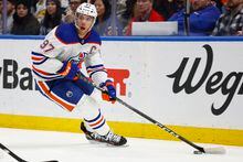 Edmonton Oilers center Connor McDavid (97) carries the puck during the second period of an NHL hockey game against the Buffalo Sabres, Monday, March 6, 2023, in Buffalo, N.Y. (AP Photo/Jeffrey T. Barnes)