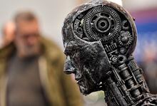 In this Nov. 29, 2019, file photo, a metal head made of motor parts symbolizes artificial intelligence, or AI, at the Essen Motor Show for tuning and motorsports in Essen, Germany. New research shows Ontario's artificial intelligence industry was seeing tremendous growth in jobs and investments ahead of the broader tech downturn that materialized earlier this year, but the sector is unlikely to remain unscathed. THE CANADIAN PRESS/AP/Martin Meissner