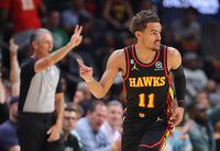 ATLANTA, GEORGIA - APRIL 21:  Trae Young #11 of the Atlanta Hawks reacts after hitting a three-point basket against the Boston Celtics during the second quarter of Game Three of the Eastern Conference First Round Playoffs at State Farm Arena on April 21, 2023 in Atlanta, Georgia.  NOTE TO USER: User expressly acknowledges and agrees that, by downloading and or using this photograph, User is consenting to the terms and conditions of the Getty Images License Agreement.  (Photo by Kevin C. Cox/Getty Images)