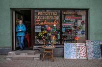 Malgorzata Kopec stands in front of her souvenir shop in front of the town square in Duszniki-ZdrÛj. Ms. Kopec worries the Ukrainians will put pressure on local housing, jobs and the school. 04.07.2022 Duszniki Zdroj, Poland