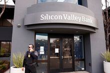 FILE PHOTO: A security guard stands outside of the entrance of the Silicon Valley Bank headquarters in Santa Clara, California, U.S., March 13, 2023. REUTERS/Brittany Hosea-Small