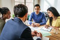 Multi ethnic group of Millennial investors planning new gainful activity