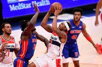 Washington Wizards guard Bradley Beal (3) goes to the basket against Detroit Pistons center Isaiah Stewart (28) during the first half of an NBA basketball game, Saturday, April 17, 2021, in Washington. (AP Photo/Nick Wass)