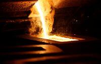 FILE PHOTO: Liquid gold is poured to form gold dore bars at Newmont Corp's Carlin gold mine operation near Elko, Nevada May 21, 2014. REUTERS/Rick Wilking/File Photo