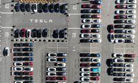 New Tesla cars sit in a parking lot at the Tesla factory on Oct. 19 in Fremont, California.