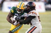 In two previous meetings this season, the B.C. Lions have outscored the Edmonton Elks by a combined score of 49-0. But now, with Tre Ford at quarterback, the Elks have won four of their last five heading into a rematch on Friday. B.C. Lions' Amir Siddiqi (93) tackles Edmonton Elks' Kevin Brown (4) during second half CFL action in Edmonton, Alta., on Saturday July 29, 2023. THE CANADIAN PRESS/Jason Franson.
