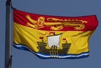 New Brunswick's provincial flag flies in Ottawa, Monday, July 6, 2020. An organization representing eight Mi’kmaq groups in New Brunswick is joining a court challenge to the federal government's approval of a new offshore oil project in Newfoundland. THE CANADIAN PRESS/Adrian Wyld