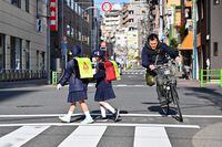 (FILES) In this file photo taken on March 19, 2019 girls go to school in Tsukiji district, Tokyo. - Japan marks the end of an era with Tuesday's abdication of Emperor Akihito, and the outgoing monarch leaves behind a much-changed country. Japan's shrinking population is among the country's most pressing social and economic issues. (Photo by CHARLY TRIBALLEAU / AFP) / TO GO WITH AFP STORY "JAPAN-ROYALS-HISTORY" BY MIWA SUZUKICHARLY TRIBALLEAU/AFP/Getty Images
