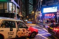 A passenger is driven in a taxi past an entry point (back C) that leads into the popular drinking spot Lan Kwai Fong (LKF) in Hong Kong on May 29, 2020. - The United States and Britain on May 29 defied China's anger by raising Hong Kong's autonomy at the UN Security Council as President Donald Trump prepared new measures against Beijing. (Photo by Anthony WALLACE / AFP) (Photo by ANTHONY WALLACE/AFP via Getty Images)