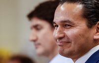 Manitoba Premier Wab Kinew, with Prime Minister Justin Trudeau, smiles at Red River College Polytechnic in Winnipeg, Thursday, Feb. 15, 2024. The Manitoba government says its fuel-tax cut is helping to keep the inflation rate low, but is not saying how long the cut will remain in place.THE CANADIAN PRESS/John Woods