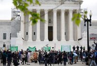 WASHINGTON, DC - APRIL 25: Demonstrators participate in a protest outside the U.S. Supreme Court on April 25, 2024 in Washington, DC. The Supreme Court is scheduled to hear oral arguments in the Trump v. United States, a case about presidential immunity from prosecution on obstruction and conspiracy charges. (Photo by Kevin Dietsch/Getty Images)