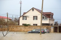 An area near the Evpatoria - Saki highway is covered with water after a storm in Crimea, Monday, Nov. 27, 2023. A storm in the Black Sea took down power grids and left almost half a million people without power after it flooded roads, ripped up trees and damaged buildings in Crimea, Russian state news agency Tass said. (AP Photo)
