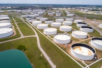 FILE PHOTO: Crude oil storage tanks are seen in an aerial photograph at the Cushing oil hub in Cushing, Oklahoma, U.S. April 21, 2020. REUTERS/Drone Base