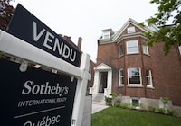 Real estate signage showing a home that has sold is seen on Monday, May 15, 2023 in Montreal. The Quebec Professional Association of Real Estate Brokers says Montreal-area home sales in December fell four per cent compared with the same month a year earlier. THE CANADIAN PRESS/Christinne Muschi