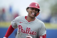 Philadelphia Phillies center fielder Cristian Pache runs the bases after hitting a home run in the sixth inning of a spring training baseball game against the Toronto Blue Jays Thursday, Feb. 29, 2024, in Dunedin, Fla. (AP Photo/Charlie Neibergall)