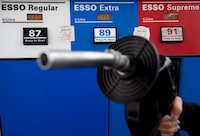Gas prices are displayed as a motorist prepares to pump gas at a station in North Vancouver on May 10, 2011. Parkland Corp. says it will not go ahead with its plan to build a stand-alone renewable diesel complex at its refinery in Burnaby, B.C. THE CANADIAN PRESS/Jonathan Hayward