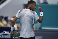 Felix Auger-Aliassime, of Canada, celebrates winning a game over Adam Walton, of Australia, in their men's first round match at the Miami Open tennis tournament, Thursday, March 21, 2024, in Miami Gardens, Fla. (AP Photo/Rebecca Blackwell)