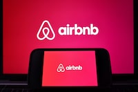 LOS ANGELES, CALIFORNIA - FEBRUARY 13: In this photo illustration, the Airbnb logo is displayed on a computer monitor and cell phone on February 13, 2024 in Los Angeles, California. Airbnb plans to report fourth quarter earnings today after a strong performance last quarter. (Photo Illustration by Mario Tama/Getty Images)