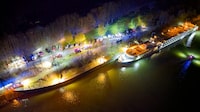 An aerial photo shows a Bulgarian cruise ship in the lock area after it crashed into a concrete wall in the night of March 29, 2024, in Aschach an der Donau, upper Austria. 17 of the about 160 passengers were injured and eleven were taken to the hospital. The ship was travelling from Bavaria towards Linz when it was apparently briefly unable to manoeuvre. (Photo by MARTIN SCHARINGER/TEAM FOTOKERSCHI / APA / AFP) / Austria OUT (Photo by MARTIN SCHARINGER/TEAM FOTOKERSCHI/APA/AFP via Getty Images)