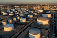 FILE PHOTO: Storage tanks are seen at Marathon Petroleum's Los Angeles Refinery, which processes domestic & imported crude oil into California Air Resources Board (CARB) gasoline, CARB diesel fuel, and other petroleum products, in Carson, California, U.S., March 11, 2022. Picture taken with a drone. REUTERS/Bing Guan/File Photo