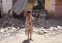 A child reacts after inspecting the damage caused by the earthquake, in her town of Amizmiz, near Marrakech, Morocco, Sunday, Sept. 10, 2023. THE CANADIAN PRESS/AP/Mosa'ab Elshamy