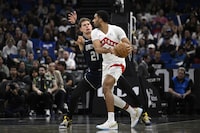 Toronto Raptors centre Jontay Porter, right, is defended by Orlando Magic centre Moritz Wagner (21) during the first half of an NBA basketball game, Sunday, March 17, 2024, in Orlando, Fla. Toronto police say they are not investigating Raptors backup centre Jontay Porter. THE CANADIAN PRESS/AP-Phelan M. Ebenhack