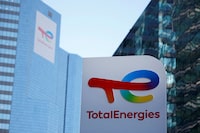 FILE PHOTO: A TotalEnergies sign is seen at an electric vehicle fuelling station in the La Defense business district in Courbevoie near Paris, France, February 8, 2023. REUTERS/Sarah Meyssonnier/File Photo