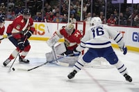 Florida Panthers defenseman Aaron Ekblad (5) and goaltender Alex Lyon (34) defend the goal as Toronto Maple Leafs right wing Mitchell Marner (16) attempts to shoot during the first period of an NHL hockey game, Monday, April 10, 2023, in Sunrise, Fla. (AP Photo/Lynne Sladky)