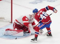 Montreal Canadiens' Lane Hutson (48) is stopped by Detroit Red Wings goaltender James Reimer (47) during shootout NHL hockey action in Montreal on Tuesday, April 16, 2024. THE CANADIAN PRESS/Christinne Muschi