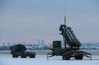 Patriot air defence system with a view of Warsaw skyscrapers in the background is seen during Polish military training on the missile systems at the airport in Warsaw, Poland February 7, 2023. REUTERS/Kacper Pempel/File Photo