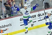 Apr 3, 2024; Tempe, Arizona, USA; Vancouver Canucks right wing Conor Garland (8) celebrates after scoring a goal in the third period against the Vancouver Canucks at Mullett Arena. Mandatory Credit: Matt Kartozian-USA TODAY Sports