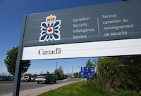 A sign for the Canadian Security Intelligence Service building is shown in Ottawa on May 14, 2013. Canada's spy agency is asking a court to toss out the claim of an employee who alleges he endured racial discrimination and physical abuse from colleagues. THE CANADIAN PRESS/Sean Kilpatrick