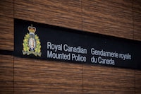 The RCMP say search warrants executed Thursday on properties southwest of Quebec City allegedly connected to a neo-Nazi terrorist group were completed without incident. The RCMP logo is seen outside Royal Canadian Mounted Police "E" Division Headquarters, in Surrey, B.C., on Friday April 13, 2018. THE CANADIAN PRESS/Darryl Dyck