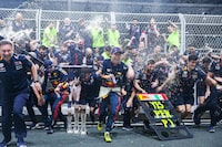 JEDDAH, SAUDI ARABIA - MARCH 19: Race winner Sergio Perez of Mexico and Oracle Red Bull Racing, Second placed Max Verstappen of the Netherlands and Oracle Red Bull Racing and the Red Bull Racing team celebrate after the F1 Grand Prix of Saudi Arabia at Jeddah Corniche Circuit on March 19, 2023 in Jeddah, Saudi Arabia. (Photo by Lars Baron/Getty Images)