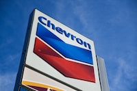 (FILES) In this file photo taken on January 26, 2022 the Chevron logo is displayed at a  gas station in El Segundo, California. - Chevron defended its new $75 billion share repurchase program from White House criticism on January 27, 2023, as it reported record profits of $35.5 billion in 2022. The oil giant, which also raised its dividend in Wednesday's buyback announcement, aims for stock purchases in a "steady, consistent way" through the ups and downs on the commodity price cycle, Chief Executive Mike Wirth said on a conference call with analysts. (Photo by Patrick T. FALLON / AFP) (Photo by PATRICK T. FALLON/AFP via Getty Images)