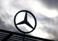 A logo of the Mercedes-Benz is seen outside a Mercedes-Benz car dealer in Brussels, Belgium March 13, 2023. REUTERS/Yves Herman/FILE PHOTO