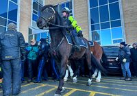 Royal Newfoundland Constabulary officers on horses try to disperse a shouting crowd as protesting fishers blocked Newfoundland and Labrador government officials from entering the legislature ahead of the scheduled presentation of the provincial budget in St.John's on Wednesday, March 20, 2024. THE CANADIAN PRESS/Sarah Smellie