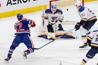 Feb 28, 2024; Edmonton, Alberta, CAN; Edmonton Oilers forward Connor McDavid (97) scores the game wining goal during overtime against St. Louis Blues goaltender Jordan Binnington (50) at Rogers Place. Mandatory Credit: Perry Nelson-USA TODAY Sports