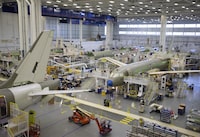 Employees work on a number of Airbus A220 airplanes  at their plant in Mirabel,  Quebec, September 23, 2020. Philippe Balducchi, Chief Executive Officer, Airbus Canada Limited said "Canadians can take great pride in the long and accomplished history of its aerospace industry, which has always allowed them to fly on aircraft that are designed and made right here in Canada. And the Airbus A220 is no exception.   (Christinne Muschi /The Globe and Mail)
