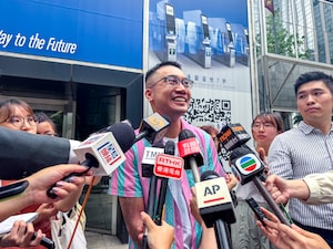 Trans activist Henry Tse speaks to the media after receiving his new Hong Kong ID card with gender listed as male on Monday, April 29, 2024.