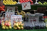 (FILES) In this file photo taken on May 12, 2022 The price of fruit and vegetables in pounds sterling is displayed on a trader's market stall in London. - British annual inflation unexpectedly accelerated in February despite central bank efforts to tame a growing cost-of-living crisis, official data showed on March 22, 2023. "Food and non-alcoholic drink prices rose to their highest rate in over 45 years with particular increases for some salad and vegetable items as high energy costs and bad weather across parts of Europe led to shortages and rationing." (Photo by JUSTIN TALLIS / AFP) (Photo by JUSTIN TALLIS/AFP via Getty Images)