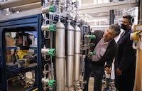 Dr. Pedro Pereira Almao, co-founder of Carbonova, inspects the company's technology with colleagues at their lab in Calgary, Alta., Thursday, July 22, 2021. Jeff McIntosh for The Globe and Mail